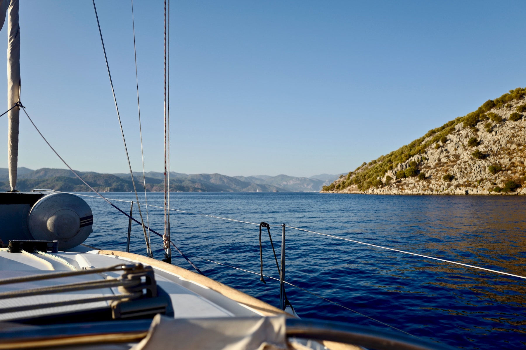 white sailboat on body of water during daytime